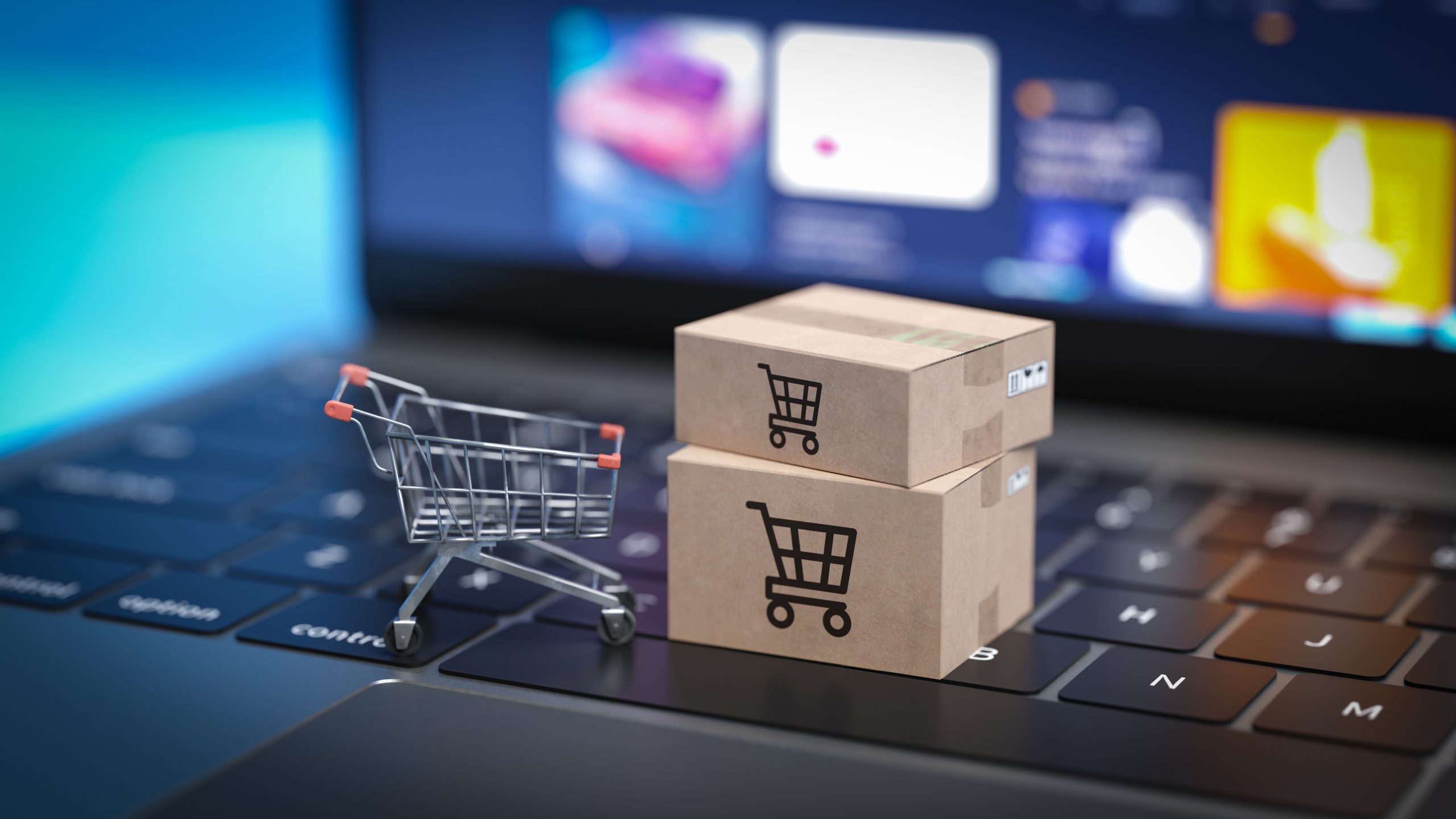 Online Shopping Represented with a Cart and Packages on a Laptop.