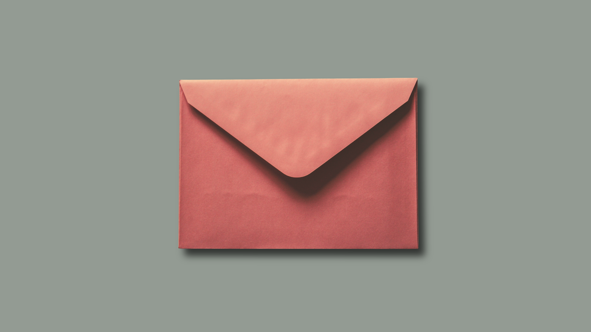 red envelope with black shadow and grey background. horizontal positioning